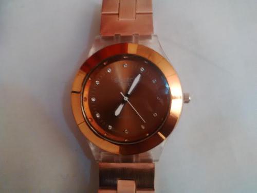 Reloj metalico marca SWATCH color bronce re - Imagen 1